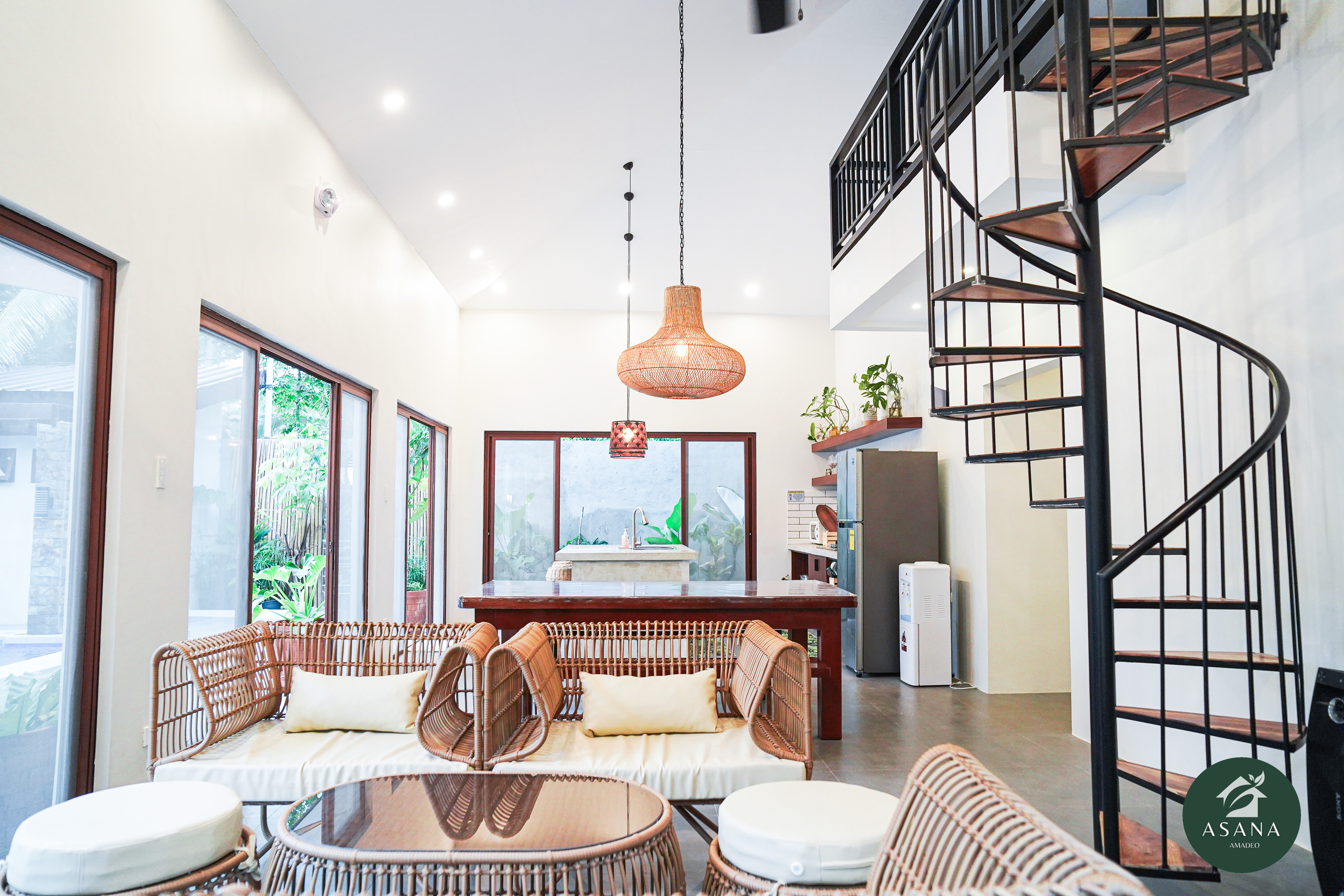 Asana Amadeo villa interior — open-concept living and pool view